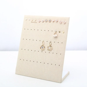 L-shaped beige microfiber jewelry display stand for earrings and studs with linen texture