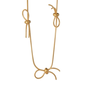 Elegant gold bow necklace with three knotted charms on a minimalist snake chain