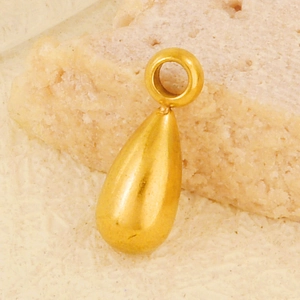Macro detail of a 3D teardrop pendant with a polished golden finish for DIY jewelry