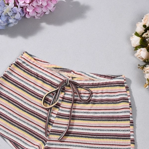Close-up of colorful striped knit shorts featuring elastic drawstring waist and soft texture