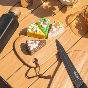 Set of two acacia wood cutting boards for cheese and fruit in a natural lifestyle setting