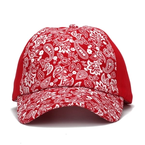 Red paisley print baseball cap with curved brim and ethnic style ponytail opening