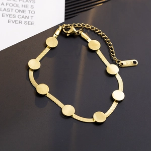 Minimalist 18K gold snake chain bracelet with circular charms and adjustable clasp