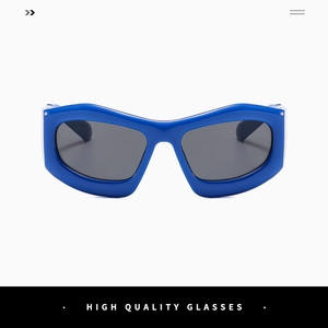 Close-up of bright blue bubble-style wide frame sunglasses with dark lenses for street style