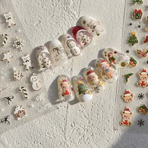 Stickers ongles Noël 3D avec motifs père Noël et bonhomme de neige en relief doré
