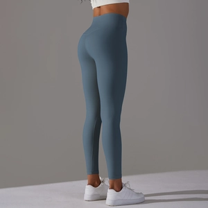Detail view of high-waisted fog blue yoga pants with peach lift effect for fitness