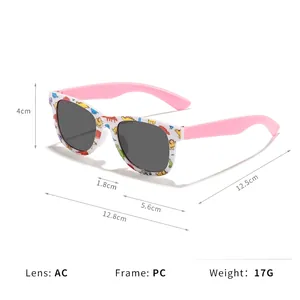 Kids dinosaur print sunglasses with white frames and pink temples in a front view