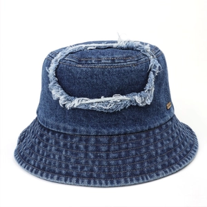 Deep blue denim bucket hat with retro distressed frayed edges and a sun protection brim