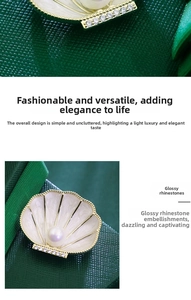 Macro detail of French retro shell brooch with pearl and sparkling rhinestones