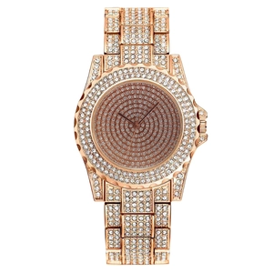 Luxurious rose gold women's watch with full crystal pavé detailing and metal link strap