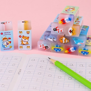 Creative cartoon erasers for kids featuring space and ocean patterns on a desk