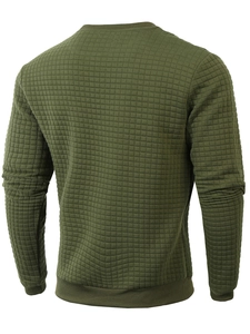 Detail of army green sweatshirt featuring quilted square texture and premium stitching