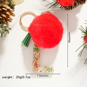 Christmas letter L keychain with red fur ball, green tassel and festive decor elements