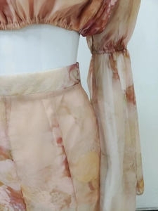Detailed view of chiffon high-waist seam and elastic cuffs with peach floral print