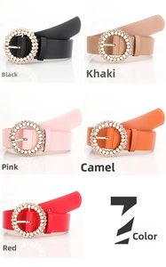 Detail view of women's waist belts with rhinestone buckles and pearl decorations