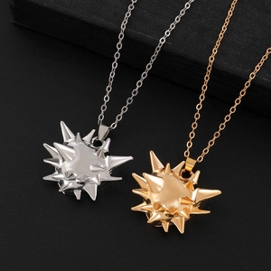 Punk style punk studded sea urchin necklaces in polished gold and silver metal finishes