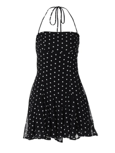 Short halter neck dress with black and white polka dot pattern and ruffled hem
