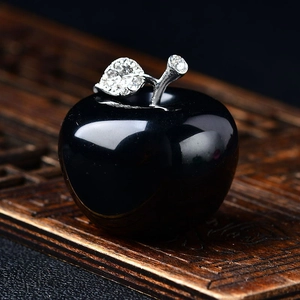 Polished black crystal apple ornament with sparkling silver rhinestone leaf detail