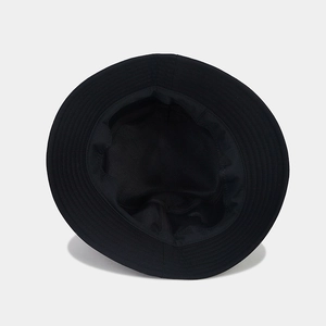 Close-up of internal stitching and high-quality canvas fabric of the black bucket hat