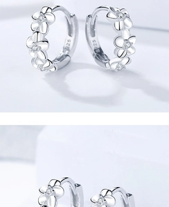 Detail of silver camellia flower earrings with micro-inlaid S925 sterling silver stamp