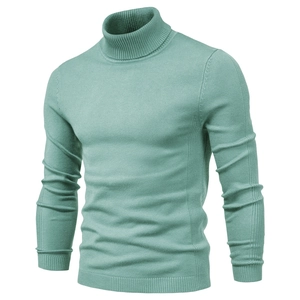 Detail of light mint green turtleneck sweater showing ribbed knit texture and slim fit