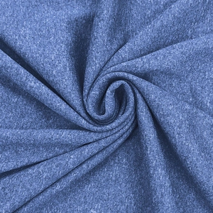 Close-up of heather blue quick-dry fabric showing fine knit texture and soft drapery