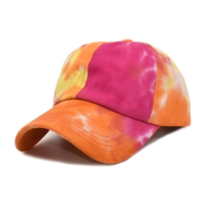 Close-up of vibrant tie-dye baseball cap featuring reinforced stitching on the brim