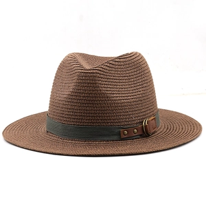 Detailed view of brown woven fedora hat with a gray ribbon and leather buckle detail