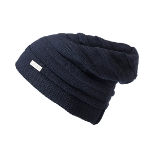 Navy blue slouchy knitted beanie with a metal fashion tag for autumn and winter warmth