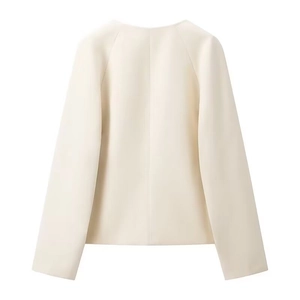 Back view detail of women's casual cream blazer showing fabric texture and clean seams