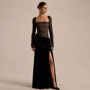 Elegant black evening gown with lace bodice, velvet skirt, and high side slit