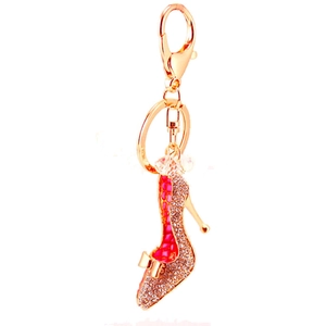 Porte-clés talon haut en or rose avec strass brillants et détail de nœud rose