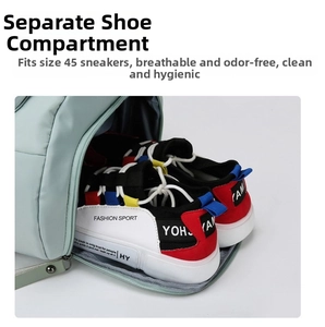 Detail view of the dedicated shoe compartment on a light green travel bag for sneakers
