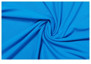 Macro detail of the bright electric blue stretch fabric showing fine knit texture