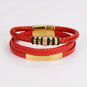 Detail of red multilayer braided leather cord with gold magnetic clasp for men