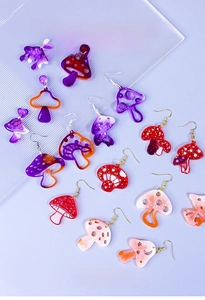 Macro shot of colorful mushroom resin earrings made with DIY handmade silicone molds