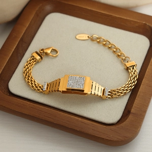 Bracelet luxueux en acier inoxydable doré avec chaîne tressée et pendentif diamant