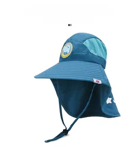 Detail of kids sun hat with neck flap, breathable mesh vents and dinosaur patch