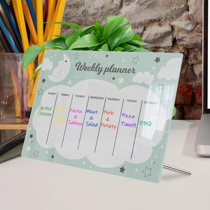 Detail of clear acrylic weekly planner with cloud pattern and Sunday to Saturday columns