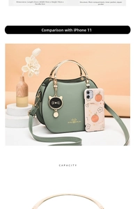Detailed view of green shell bag dimensions 23x10x18cm with cat charm and gold handle