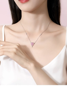 Close-up of S925 silver peach blossom necklace with pink petals and zircon accents
