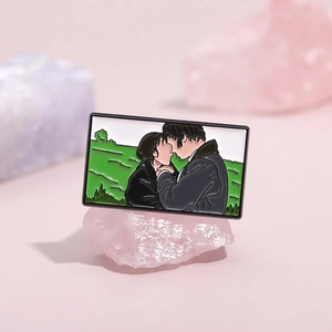 Classic Pride & Prejudice scenery enamel pin on pink crystal stone display