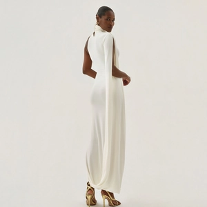 Elegant white one-shoulder maxi dress with cape detail and slim fit bodycon silhouette