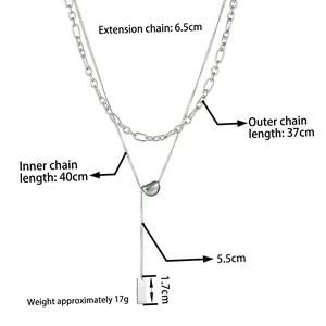 Double layered titanium steel necklace featuring geometric pendants and fringe design