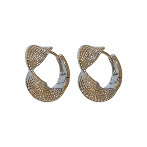 Minimalist twisted silver hoop earrings with textured metal finish for a modern look