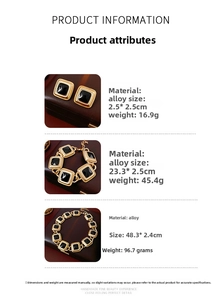 Vintage gold-tone jewelry set with black square enamel earrings, necklace and bracelet