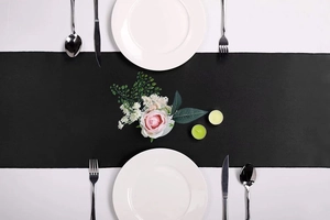 Elegant black satin table runner detail with smooth texture for luxury wedding decoration