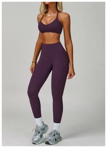 Detail of high-waisted seamless purple yoga leggings with premium matte texture