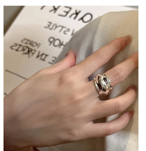 Detailed close-up of a bold silver S925 sterling silver ring worn by a fashion model