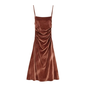 Brown velvet midi slip dress featuring elegant side ruching and a slim fit design